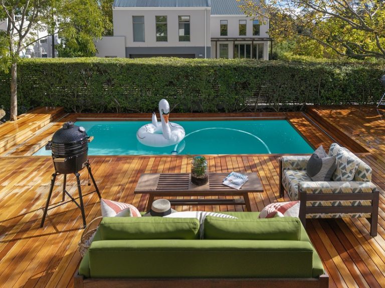 Elegant automated sliding deck pool cover installed by Geani Gold in a Stellenbosch luxury home, blending premium materials with seamless outdoor design.