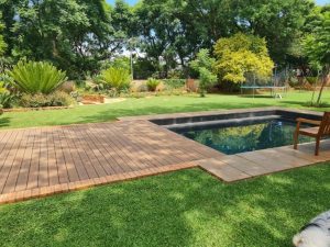 Geani Gold custom-designed pool with automated sliding deck cover in Pretoria, combining luxury aesthetics with innovative safety and space-saving features.