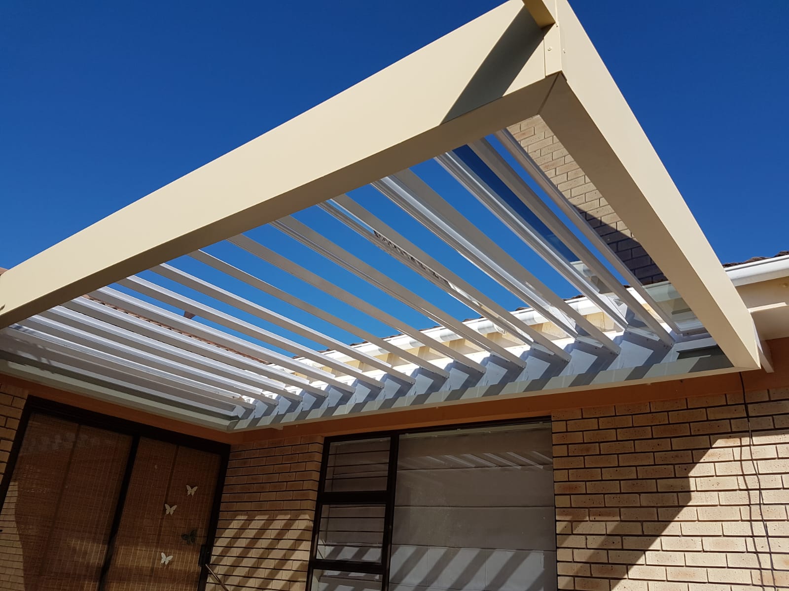 glass louvre awnings by geani gold